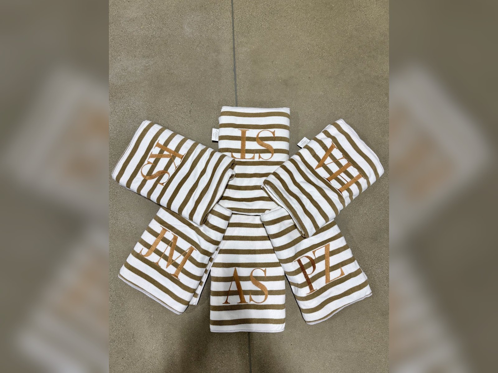 Monogrammed gold-striped towels embroidered by The Print Shop Clovis